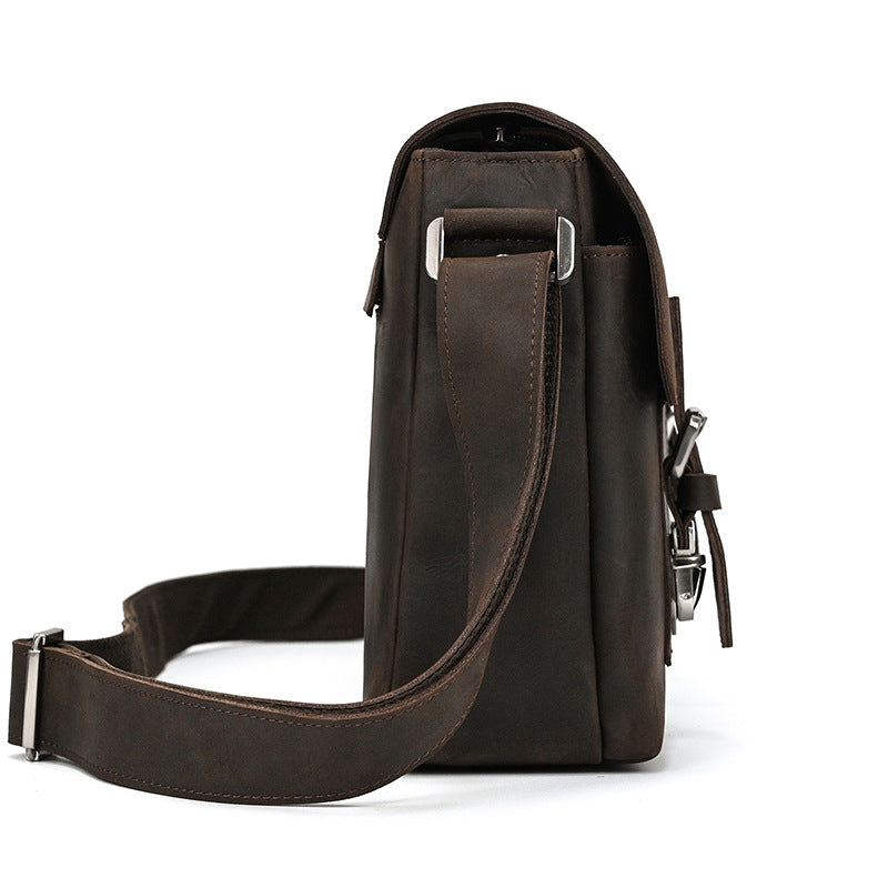 Brown leather shoulder bag on a white background