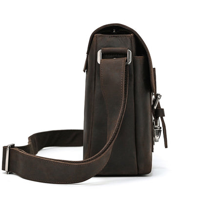 Brown leather shoulder bag on a white background