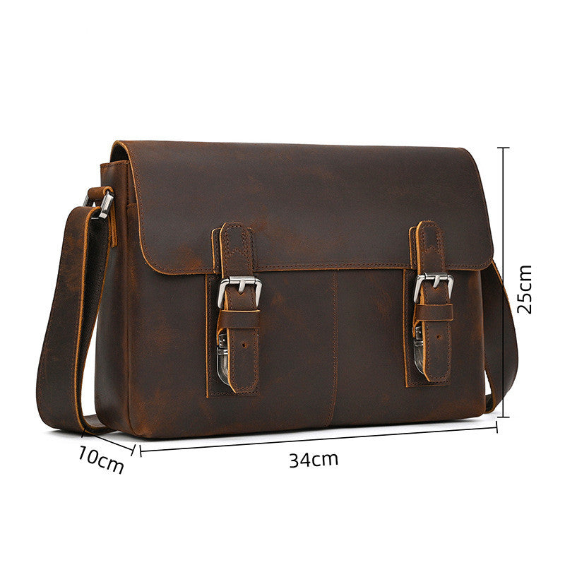 Brown leather satchel bag with measurements on a white background