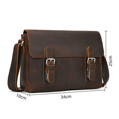 Brown leather satchel bag with measurements on a white background