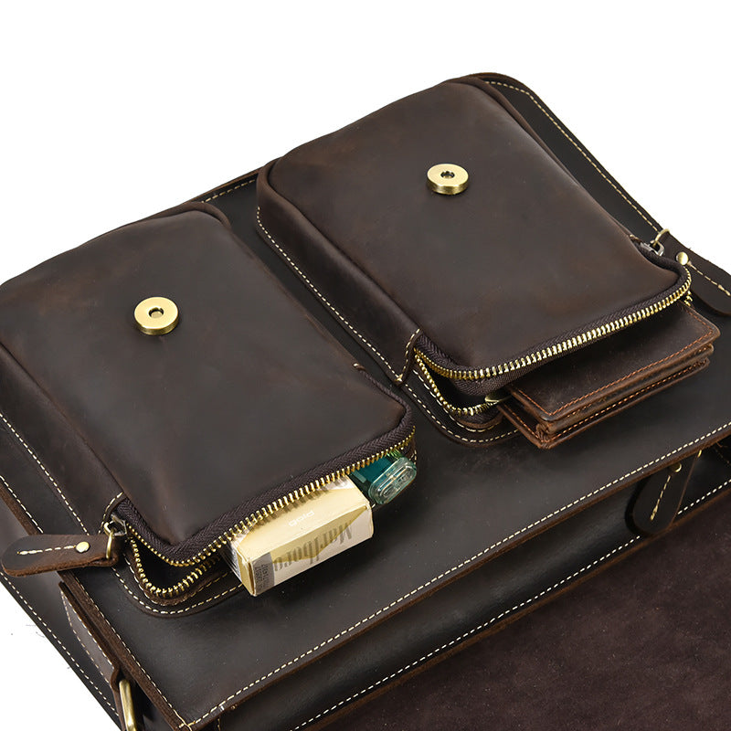 Brown leather wallet with gold zippers and accents on a white background