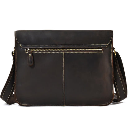 Brown leather shoulder bag with a visible zipper on a white background