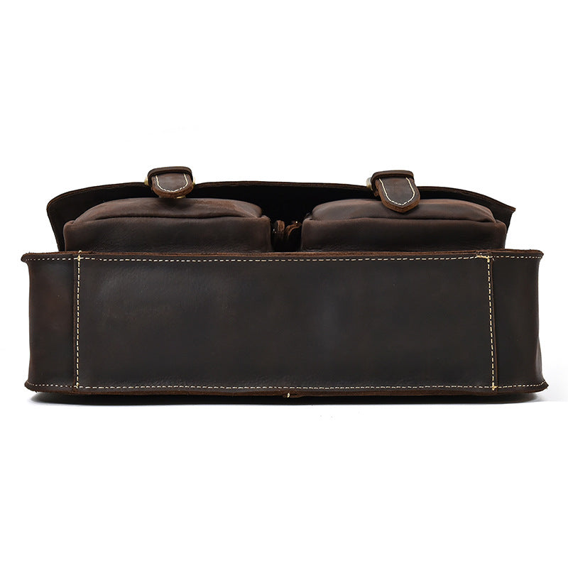 Brown leather bag with two straps on a white background