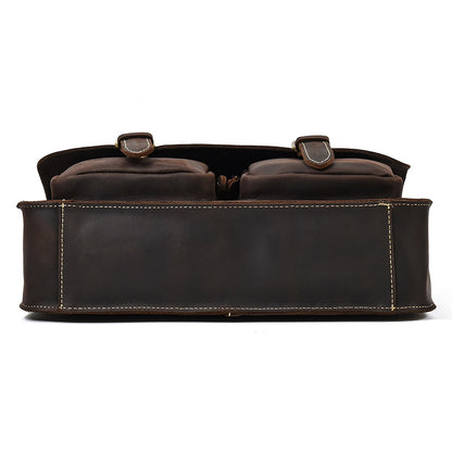 Brown leather bag with two straps on a white background