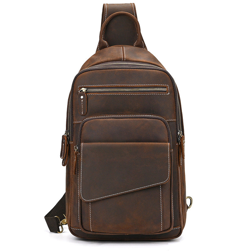 Brown leather sling bag on a white background