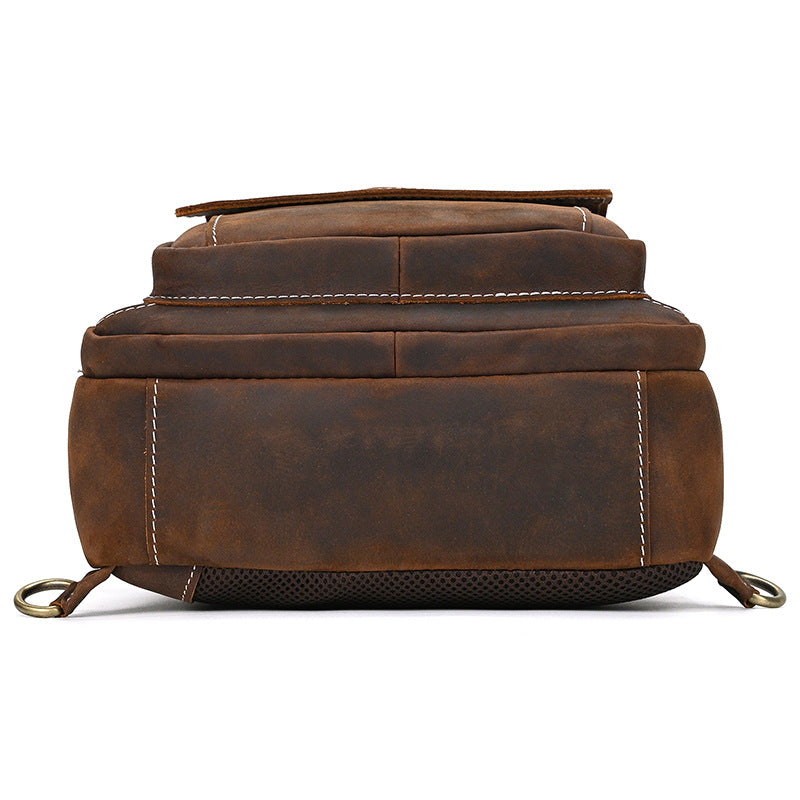Brown leather backpack on a white background