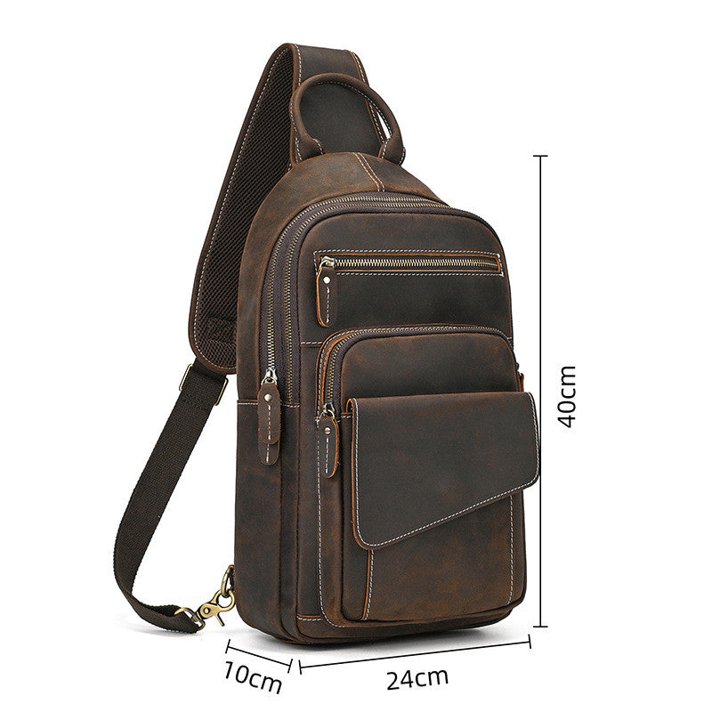 Brown leather sling bag with measurements on a white background