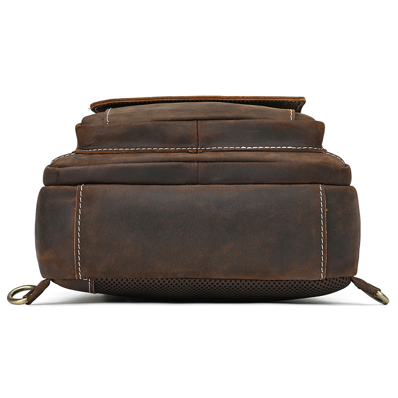 Brown leather backpack on a white background