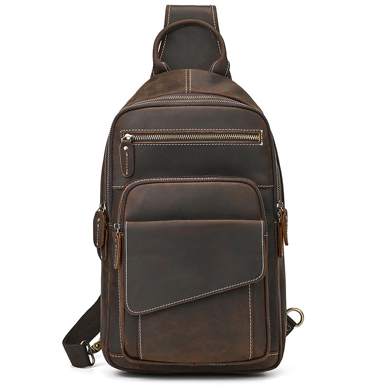 Brown leather sling bag on a white background
