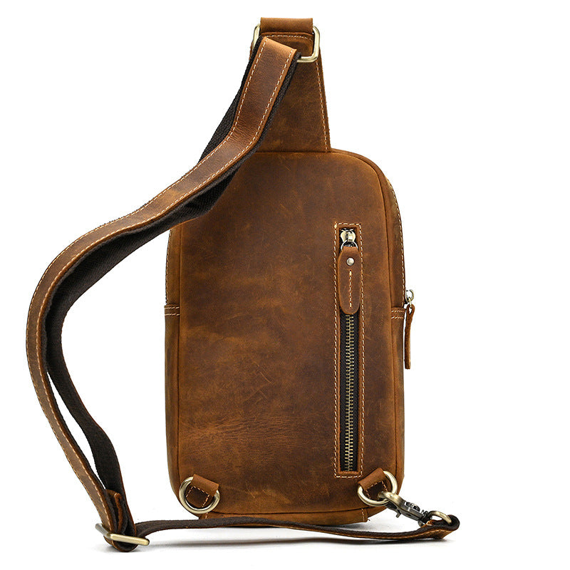 light brown leather sling bag back view vertical zipper