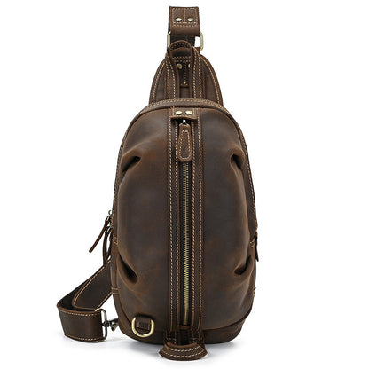Front view of the Crazy Horse Leather Travel Crossbody Bag by Timber Carry, showcasing the central brass zipper and symmetrical design.