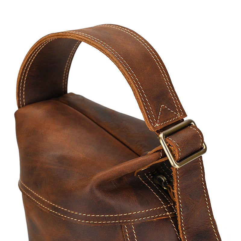 Close-up showing the bottom handle loop and D-ring on the Crazy Horse Leather Large Capacity Sling Bag.