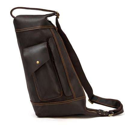 Brown leather backpack with a pocket on a white background