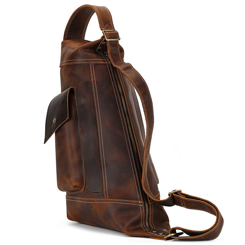 Perspective view of the Crazy Horse Leather Sling Bag, Timber Carry, highlighting the smooth curved top design.