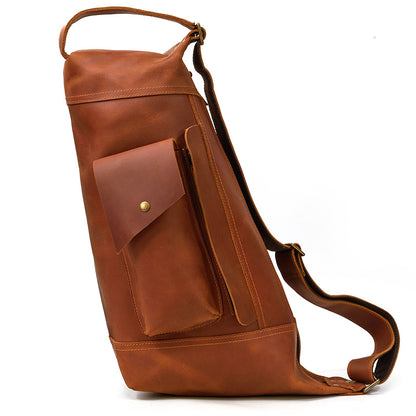 Perspective view of the Timber Carry Crazy Horse Leather Vertical Sling Bag, showing its premium brown leather texture.