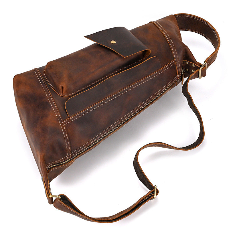 High-angle shot of the Crazy Horse Leather Crossbody Bag, Timber Carry, showcasing its vintage brown patina.