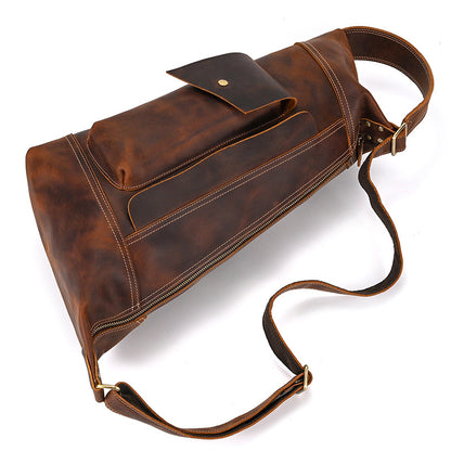High-angle shot of the Crazy Horse Leather Crossbody Bag, Timber Carry, showcasing its vintage brown patina.