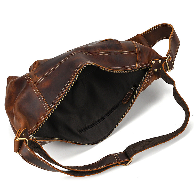 Wide-open main compartment of the Large Capacity Vertical Crossbody Pack, showing the spacious interior lining.