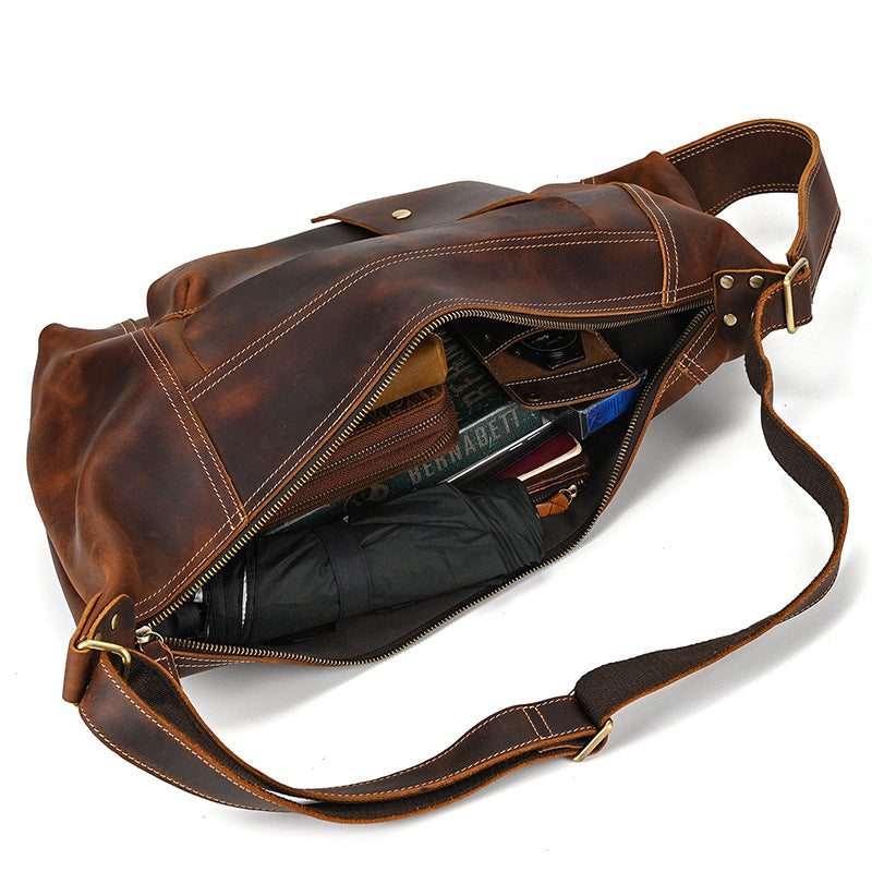 Interior of Timber Carry Sling Bag with a long wallet and smartphone, demonstrating vertical storage capacity.