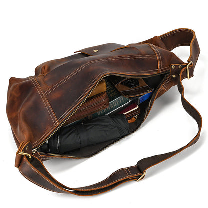 Interior of Timber Carry Sling Bag with a long wallet and smartphone, demonstrating vertical storage capacity.