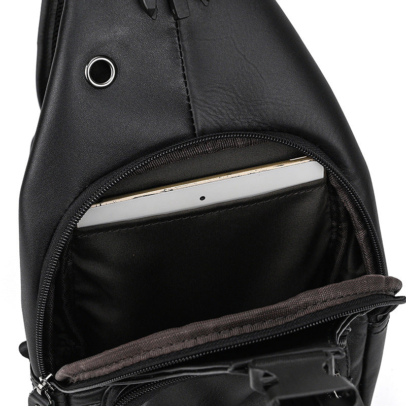 Black sling bag with a compartment holding a tablet on a white background
