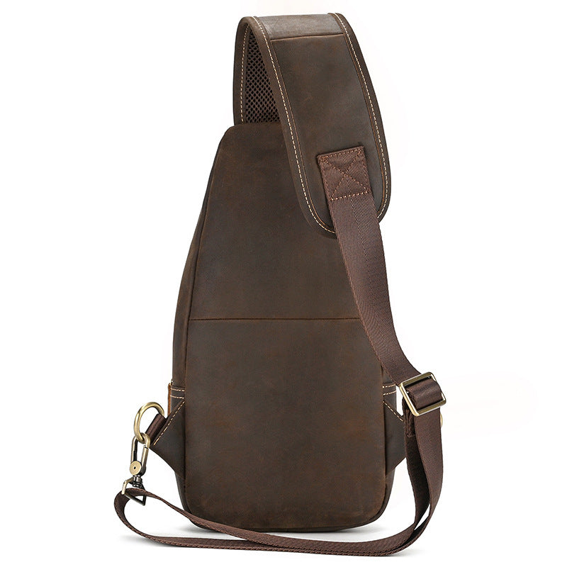Back view of Brown leather sling bag on a white background