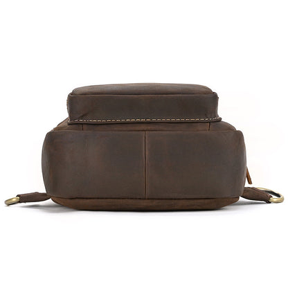 bottom view of Brown leather backpack on a white background