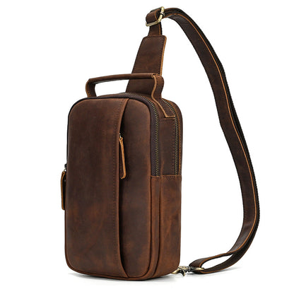 Brown leather sling bag on a white background