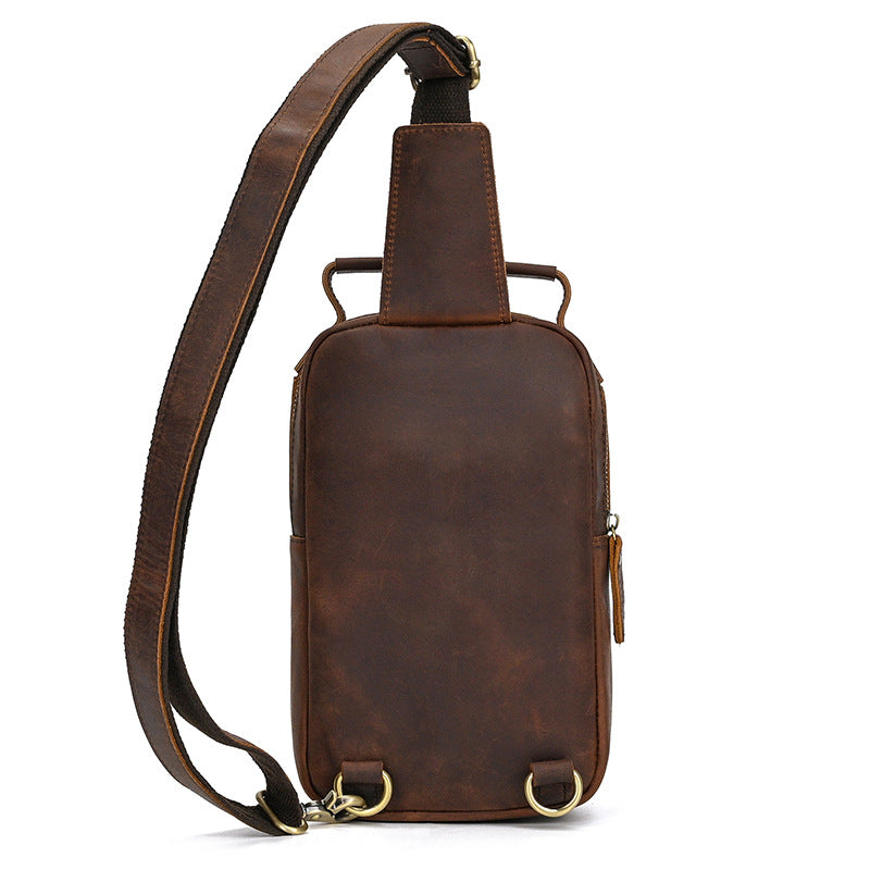 Brown leather sling bag on a white background