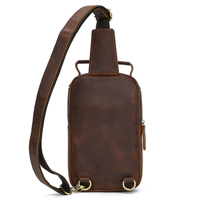 Brown leather sling bag on a white background