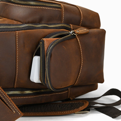 Brown leather bag with a zipper pocket on a white background