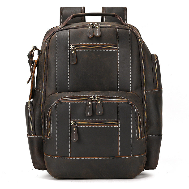 Dark Brown leather backpack with multiple pockets and zippers on a white background