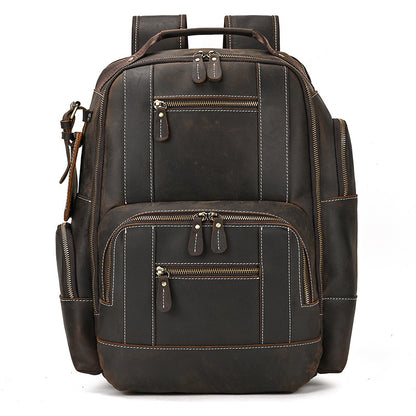 Dark Brown leather backpack with multiple pockets and zippers on a white background
