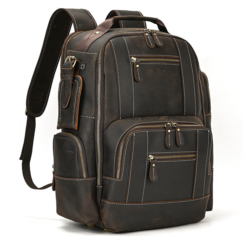 Dark Brown leather backpack with multiple pockets on a white background