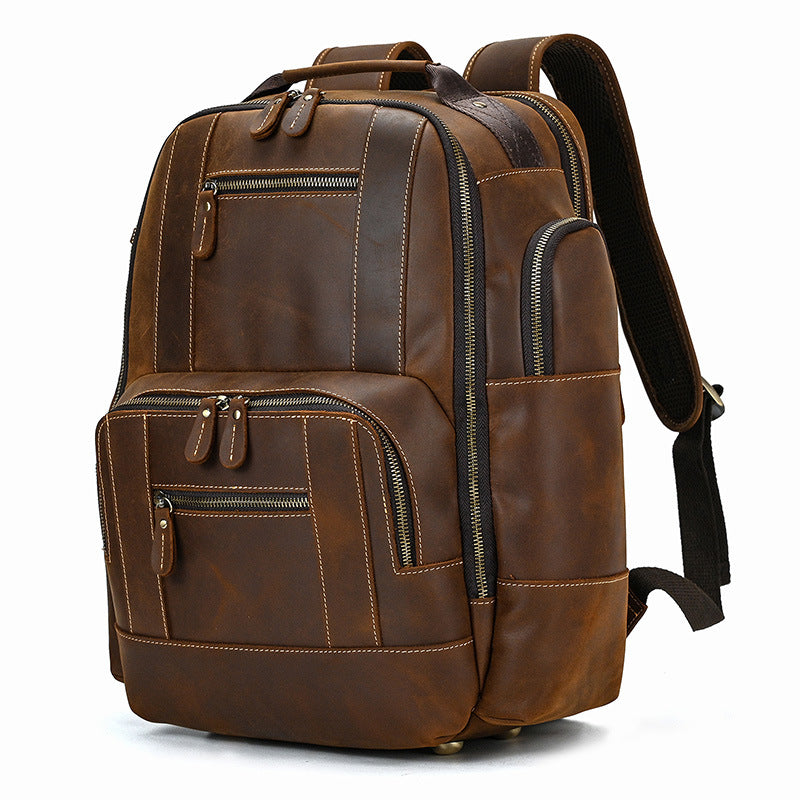 Brown leather backpack on a white background