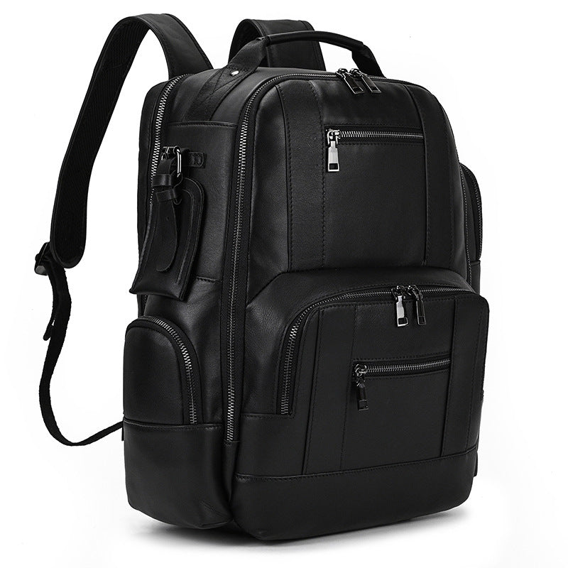 Black backpack with multiple pockets and zippers on a white background