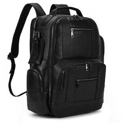 Black backpack with multiple pockets and zippers on a white background