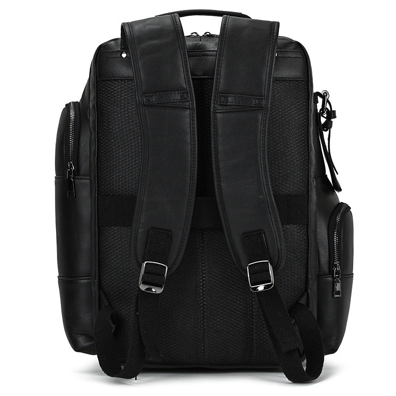 Black leather backpack with straps on a white background