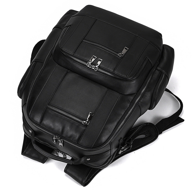 Black backpack with multiple zippers on a white background