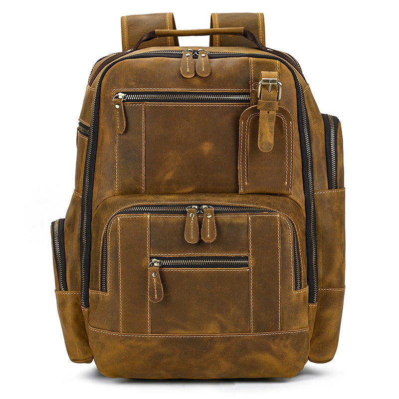 Light Brown leather backpack with multiple zippers on a white background