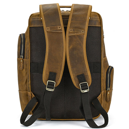 Light Brown leather backpack with black straps on a white background