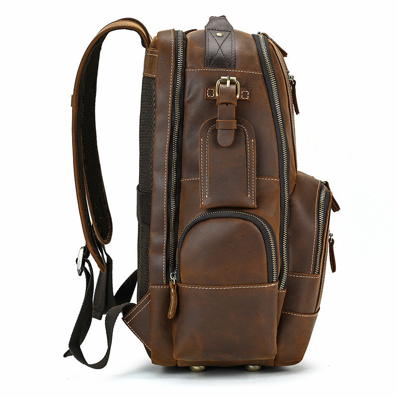 Brown leather backpack on a white background