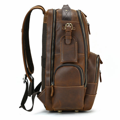 Brown leather backpack on a white background