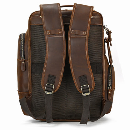 Brown leather backpack with black mesh sides on a white background