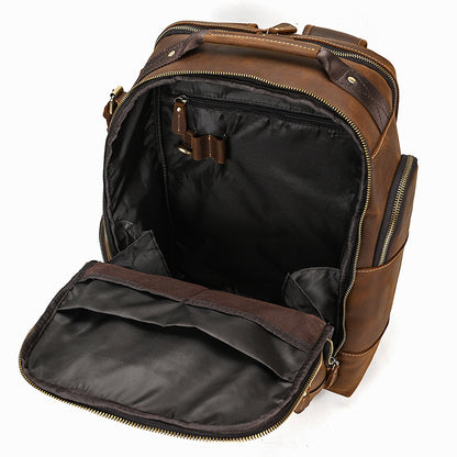 Brown leather backpack with open front compartment on a white background