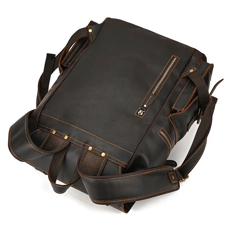 Brown leather backpack on a white background