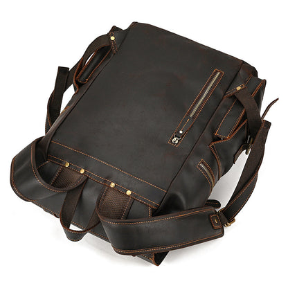Brown leather backpack on a white background