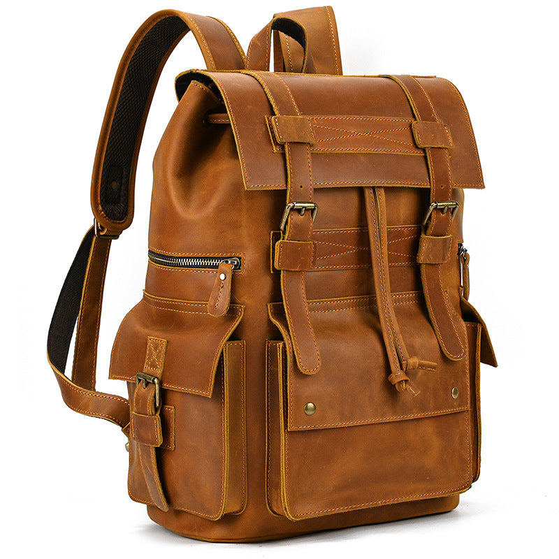 Vintage brown leather travel backpack with multiple pockets and buckle straps