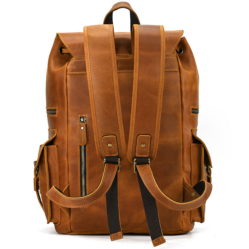 Brown leather backpack on a white background