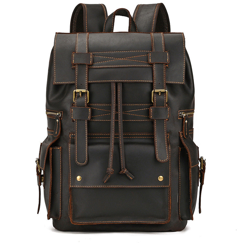 Black leather backpack with brown stitching on a white background